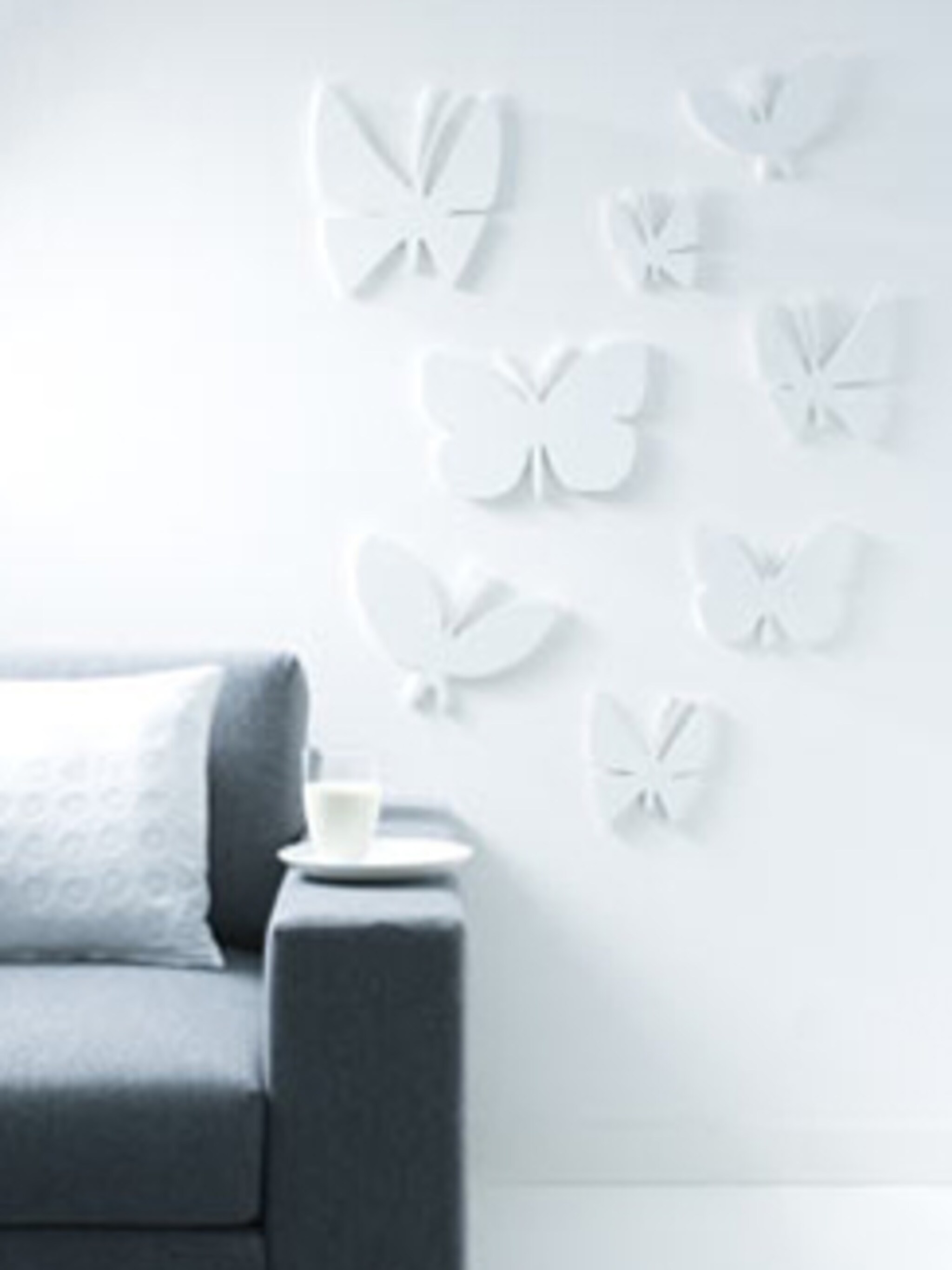 houten vlinders op de muur