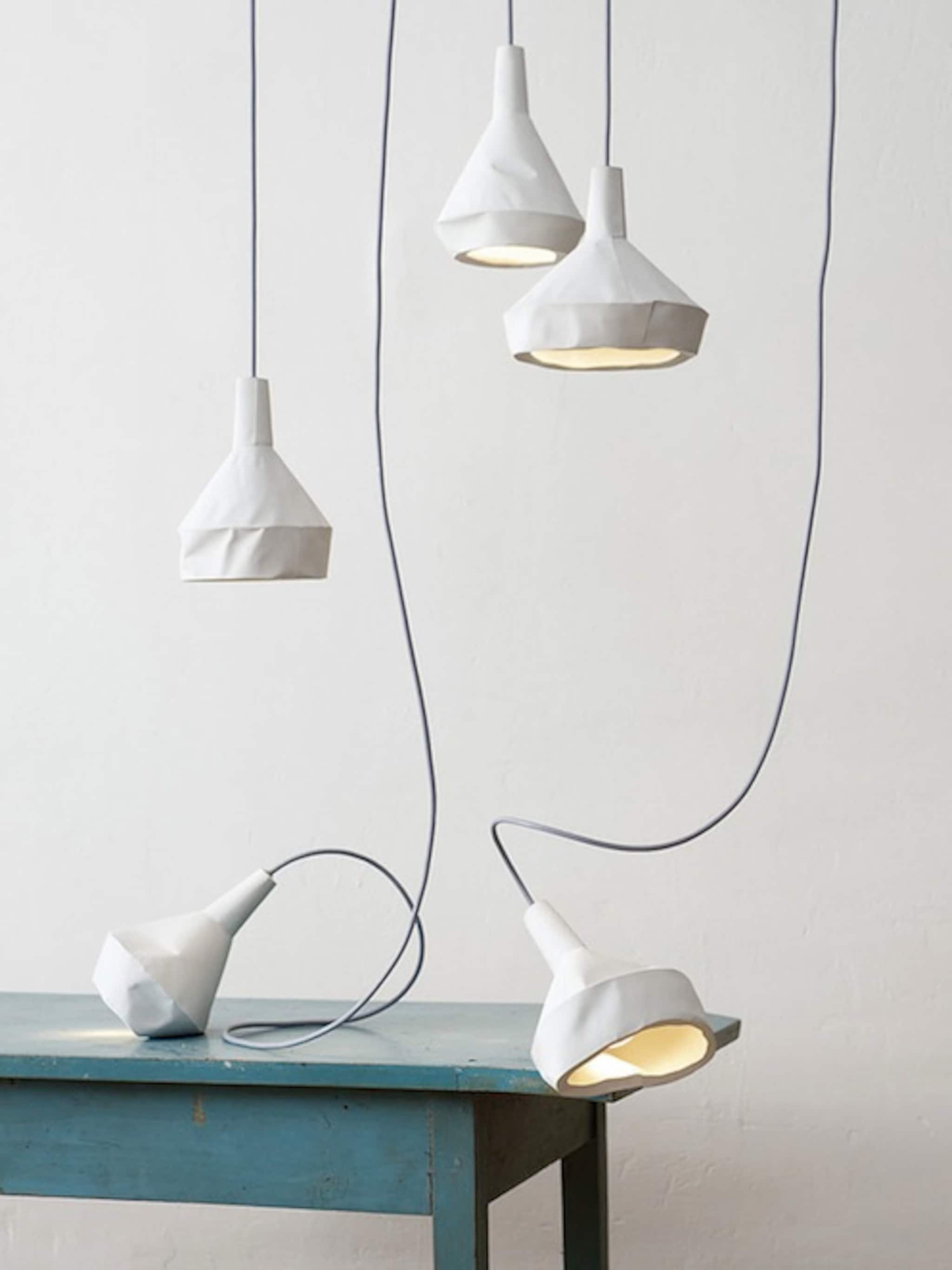 unieke lampen van beton en papier