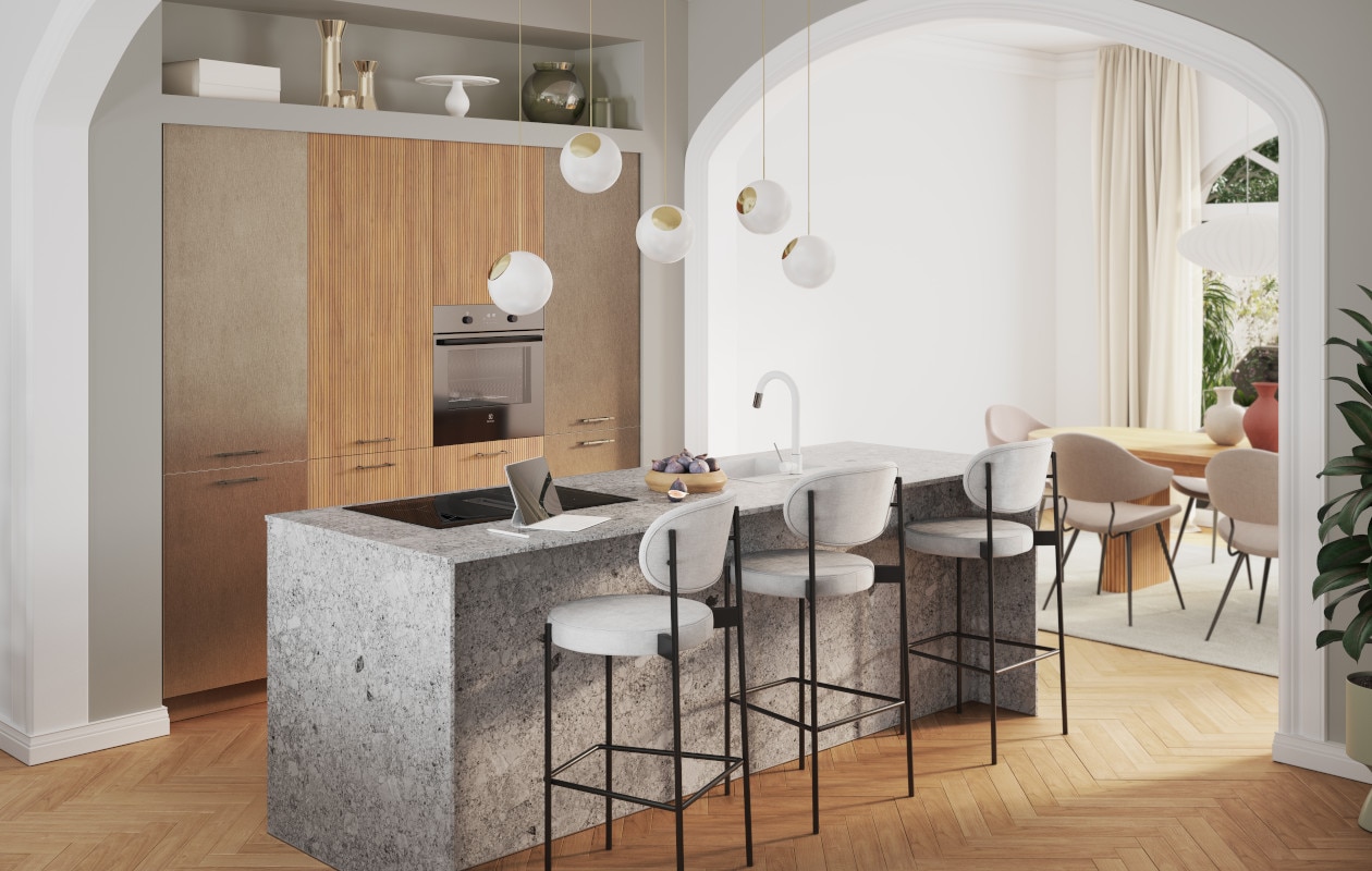 De Mambo Alux-keuken met bronskleurige fronten, geribbeld hout en terrazzo.